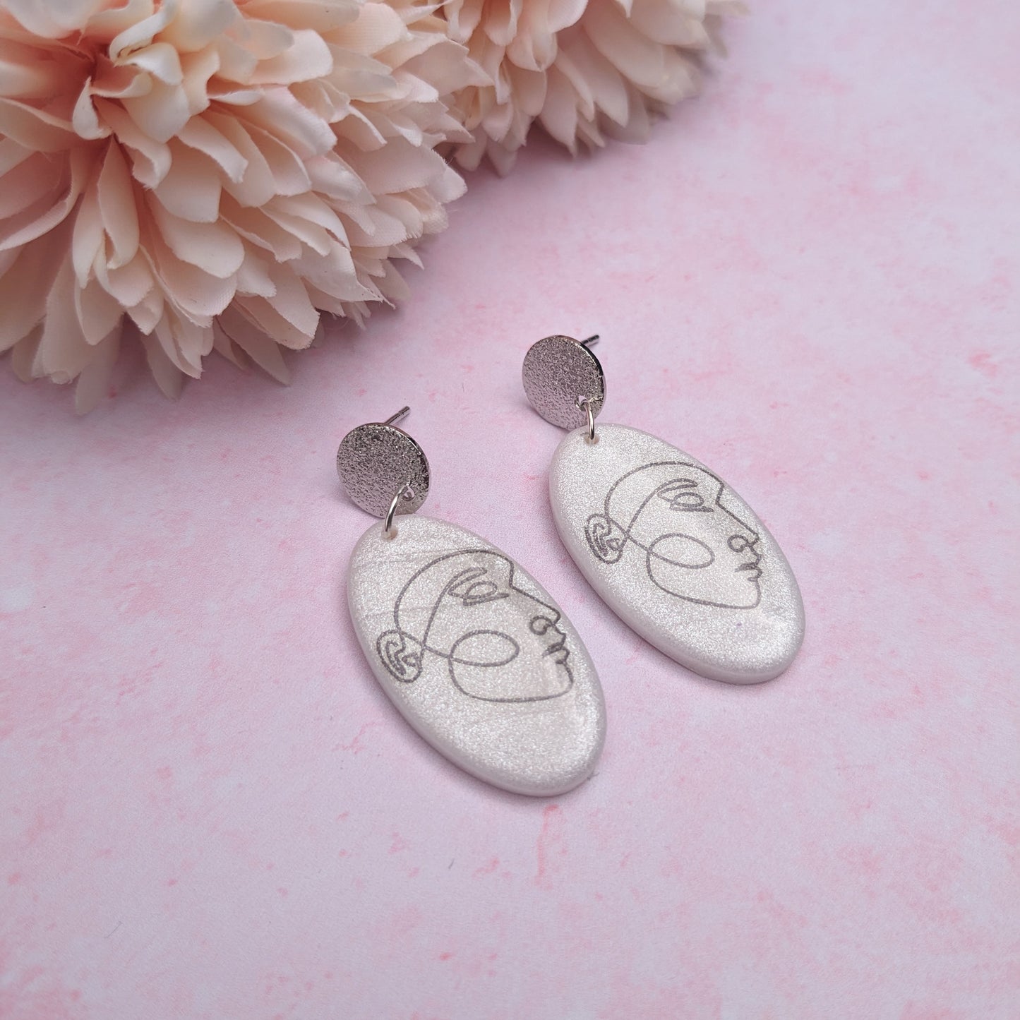 Silver Oval Swirl Face Earrings